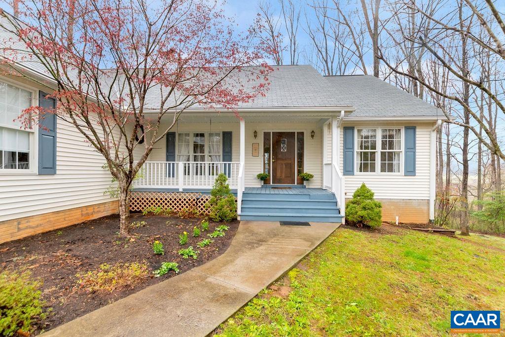 1011 Rippin Run Road Ruckersville, VA 22968 - Photo 4 of 38 a front view of a house with garden