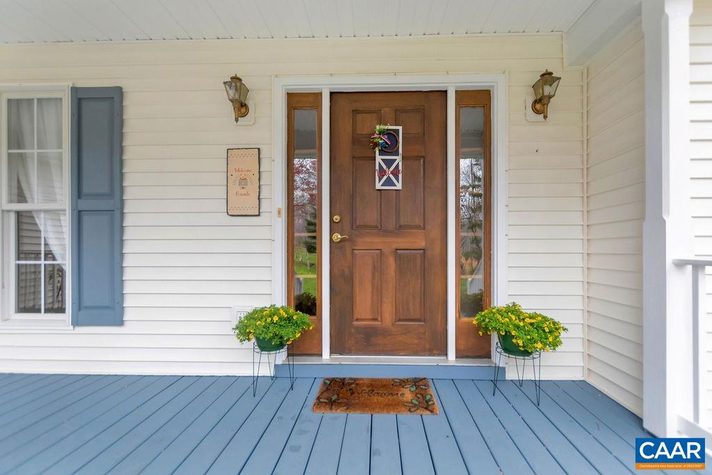 1011 Rippin Run Road Ruckersville, VA 22968 - Photo 5 of 38 a view of front door deck and potted plants