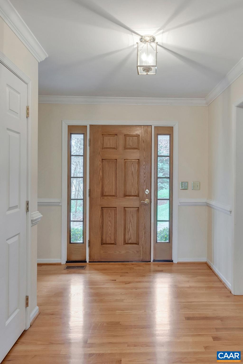 1011 Rippin Run Road Ruckersville, VA 22968 - Photo 9 of 38 an empty room with wooden floor cabinet and windows