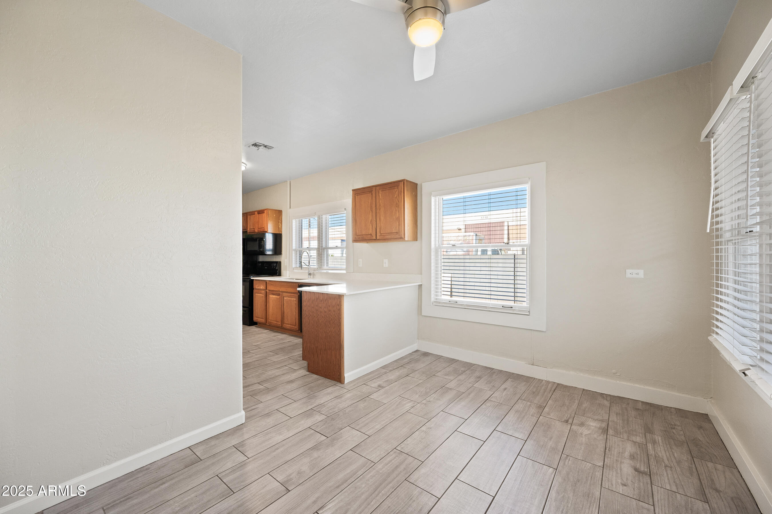 438 North 17th Avenue, Unit A Phoenix, AZ 85007 - Photo 5 of 20 a view of a kitchen with a sink dishwasher and a microwave