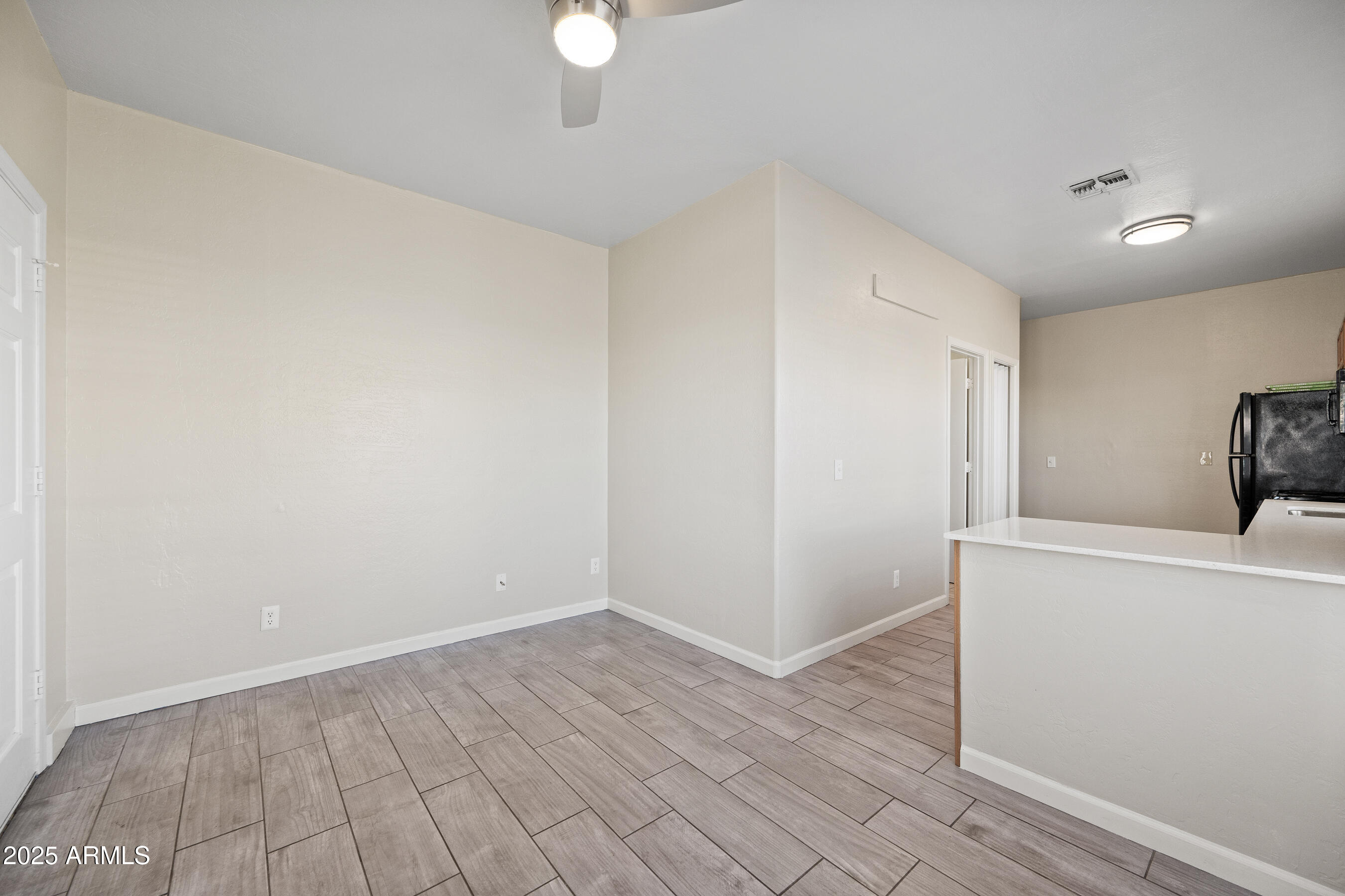 438 North 17th Avenue, Unit A Phoenix, AZ 85007 - Photo 6 of 20 a view of empty room with wooden floor