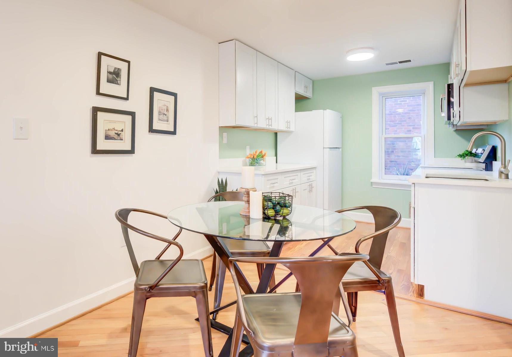 1724 17th Street Northwest, Unit 71 Washington, DC 20009 - Photo 11 of 23 a view of a dining room with furniture and a kitchen