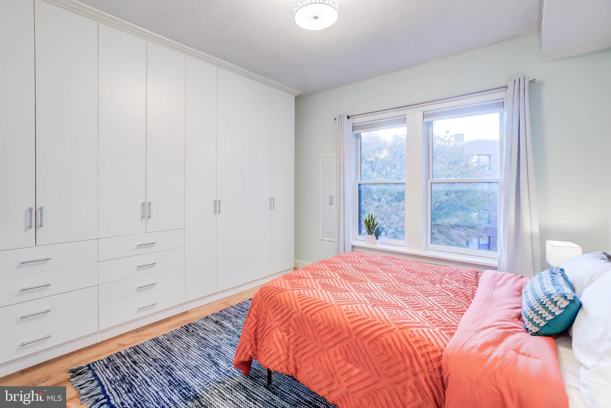 1724 17th Street Northwest, Unit 71 Washington, DC 20009 - Photo 19 of 23 a bedroom with a bed and a window