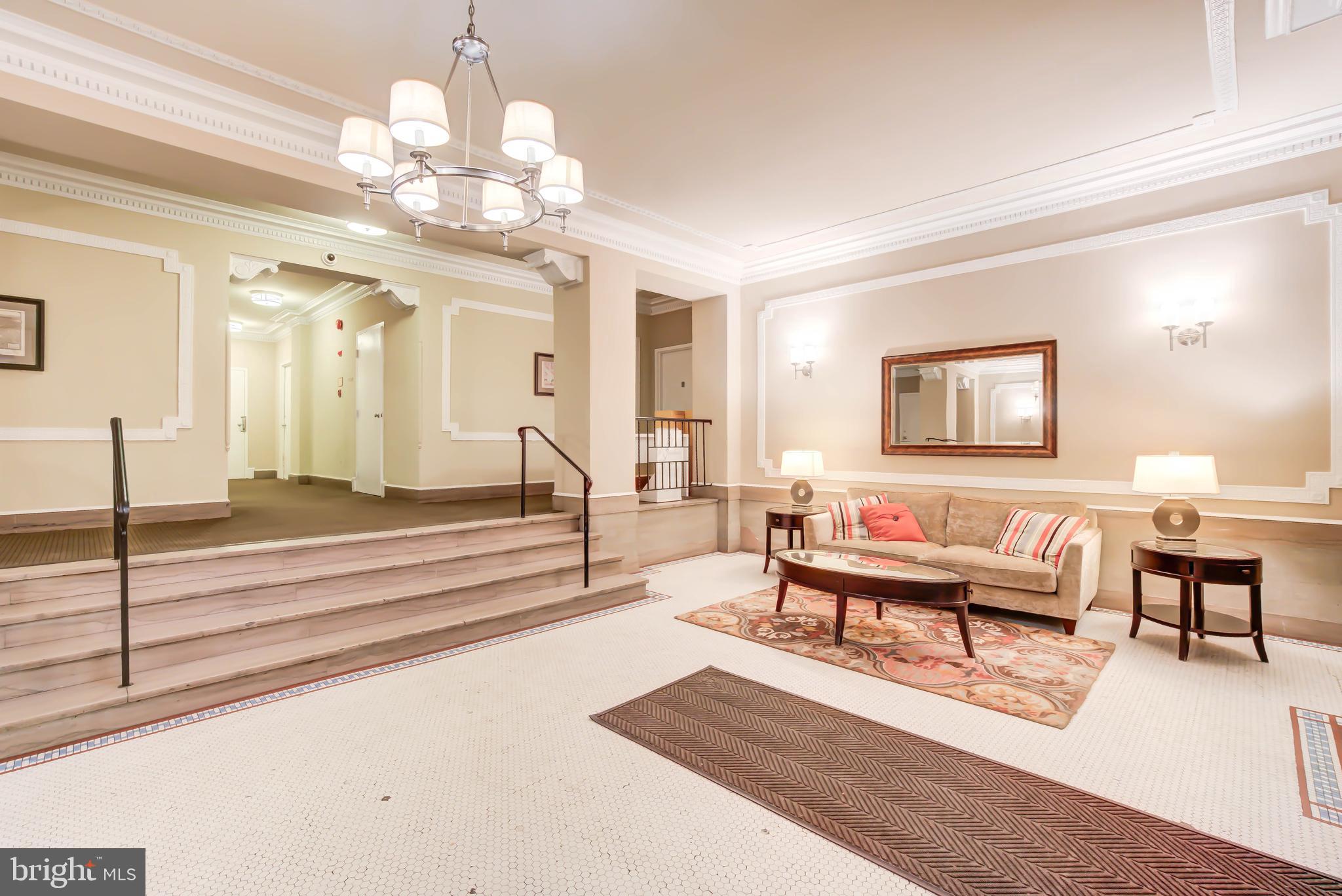 1724 17th Street Northwest, Unit 71 Washington, DC 20009 - Photo 23 of 23 a living room with furniture and a chandelier