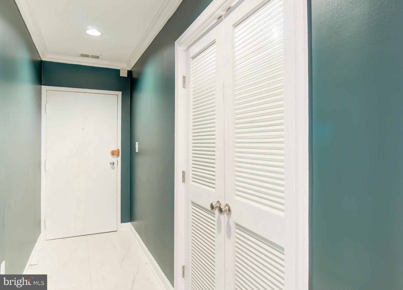 1724 17th Street Northwest, Unit 71 Washington, DC 20009 - Photo 4 of 23 a view of a hallway with a white walls