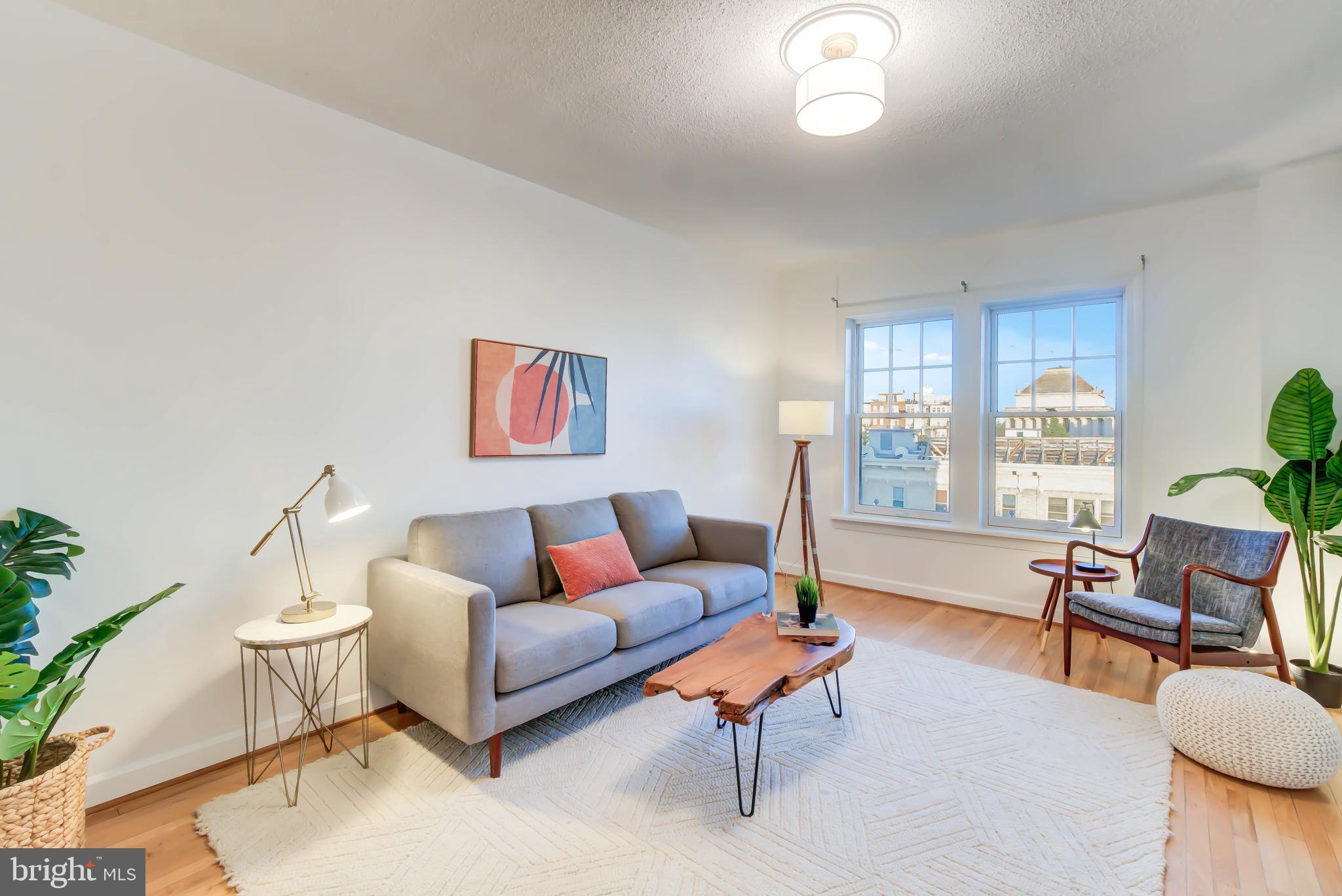 1724 17th Street Northwest, Unit 71 Washington, DC 20009 - Photo 5 of 23 a living room with furniture and a window