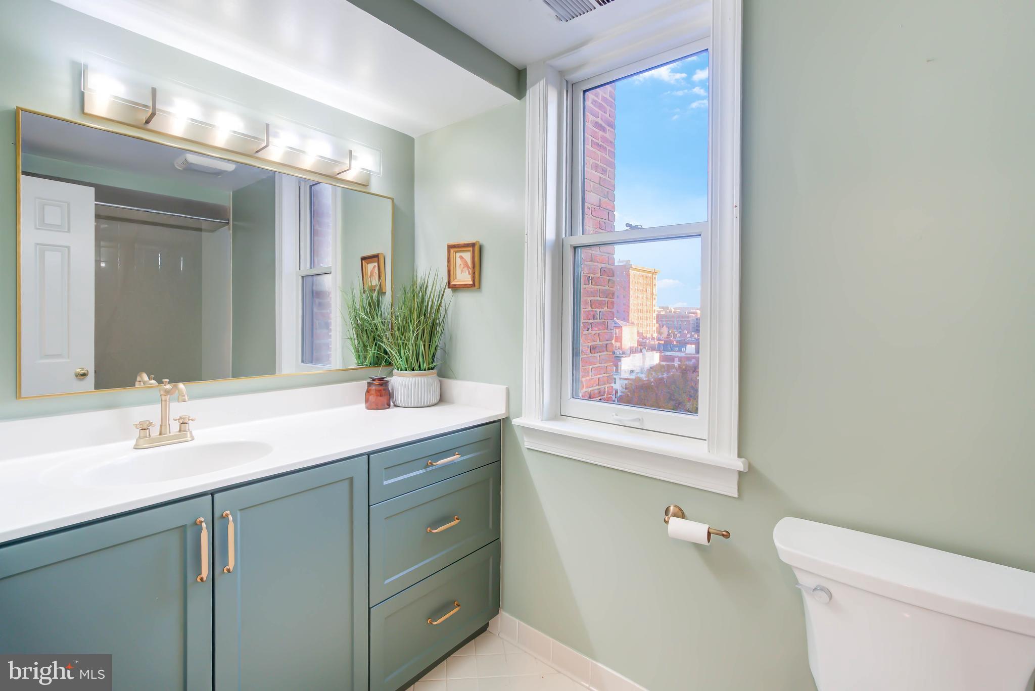1724 17th Street Northwest, Unit 71 Washington, DC 20009 - Photo 9 of 23 a bathroom with a granite countertop sink mirror and a toilet