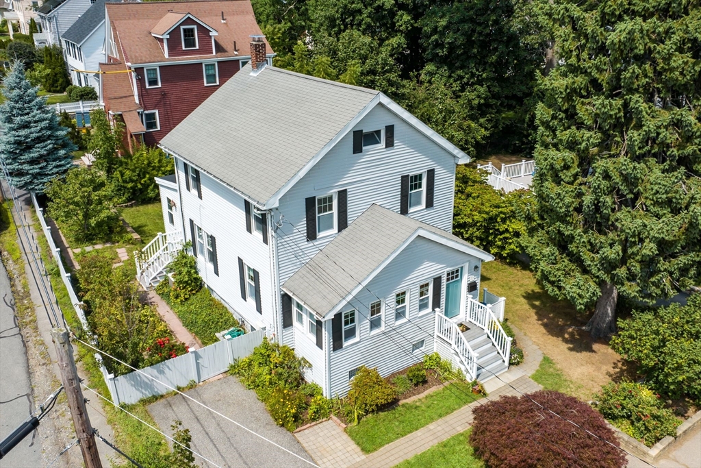 77 Grandview Road Arlington, MA 02476 - Photo 42 of 42 a aerial view of a house next to a yard