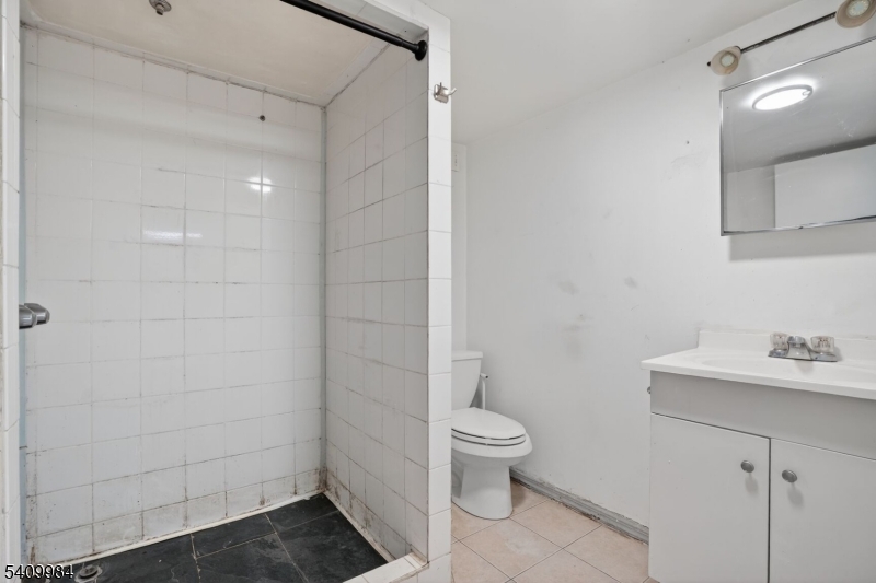 1110 Hampton Place Elizabeth, NJ 07201 - Photo 18 of 23 a bathroom with a toilet sink and shower