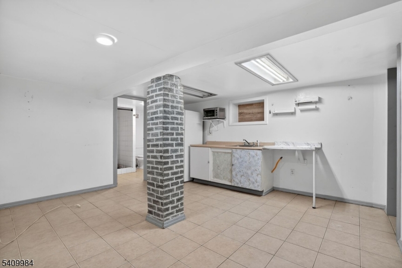 1110 Hampton Place Elizabeth, NJ 07201 - Photo 4 of 23 a room with windows and stairs