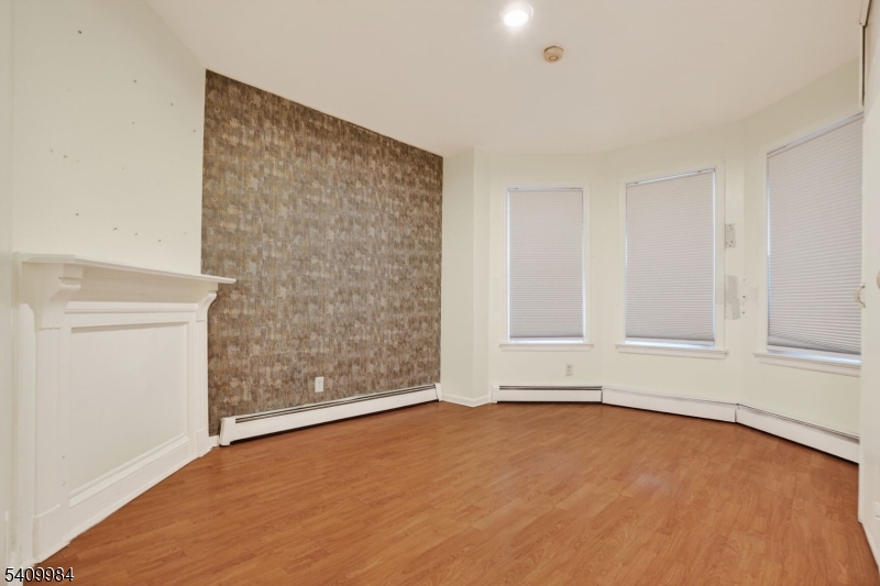 1110 Hampton Place Elizabeth, NJ 07201 - Photo 7 of 23 a view of an empty room with a window