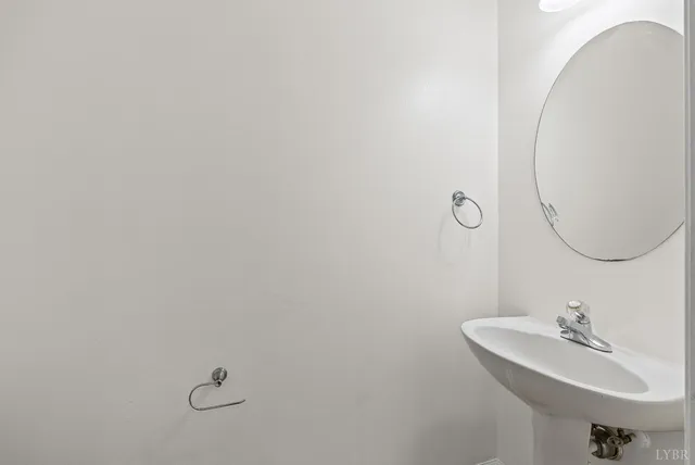 a bathroom with a sink and mirror