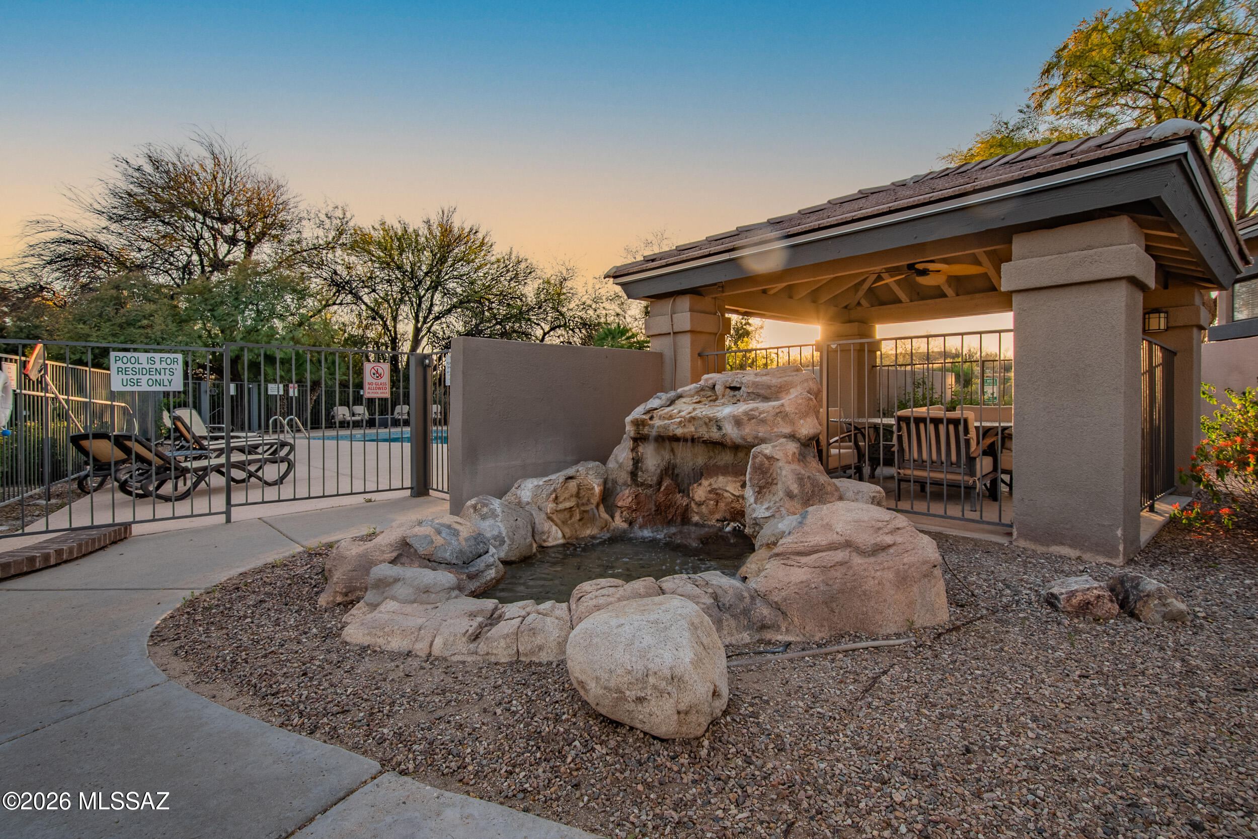 5855 North Kolb Road, Unit 6103 Tucson, AZ 85750 - Photo 8 of 31 a backyard of a house with yard and outdoor seating