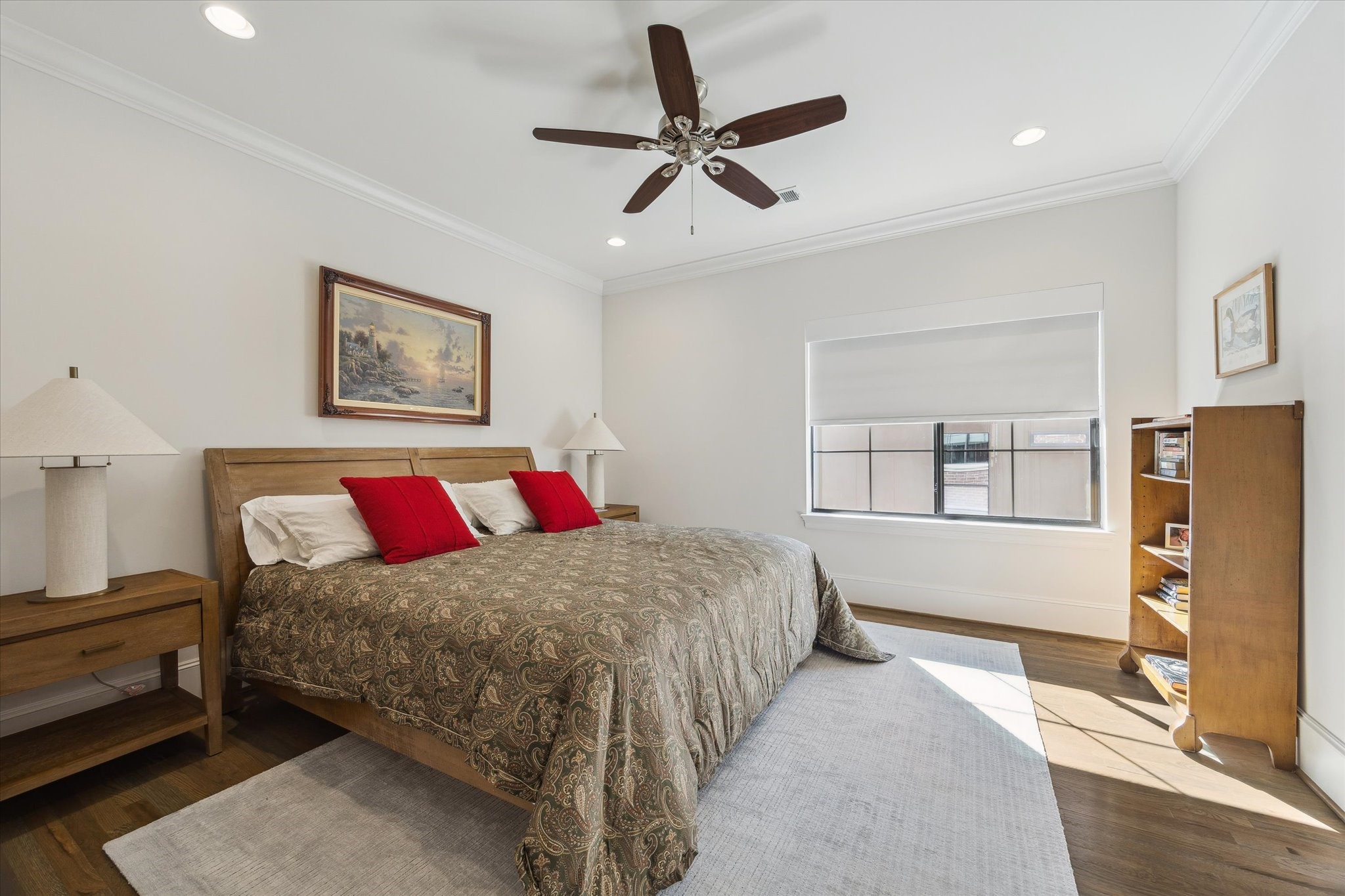 1547 Nevada Street Houston, TX 77006 - Photo 18 of 24 a bedroom with a bed and a refrigerator