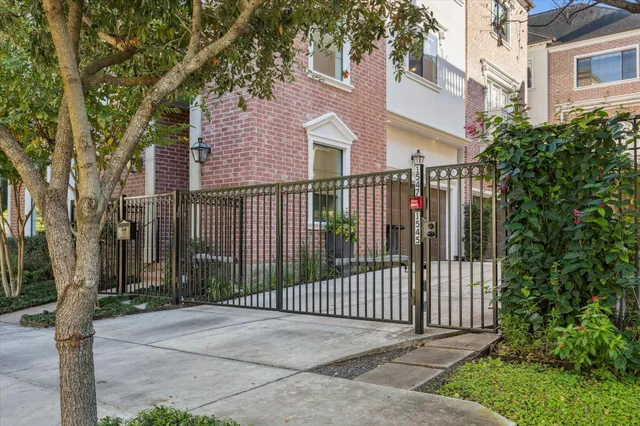 a view of a wrought iron fences in front of house