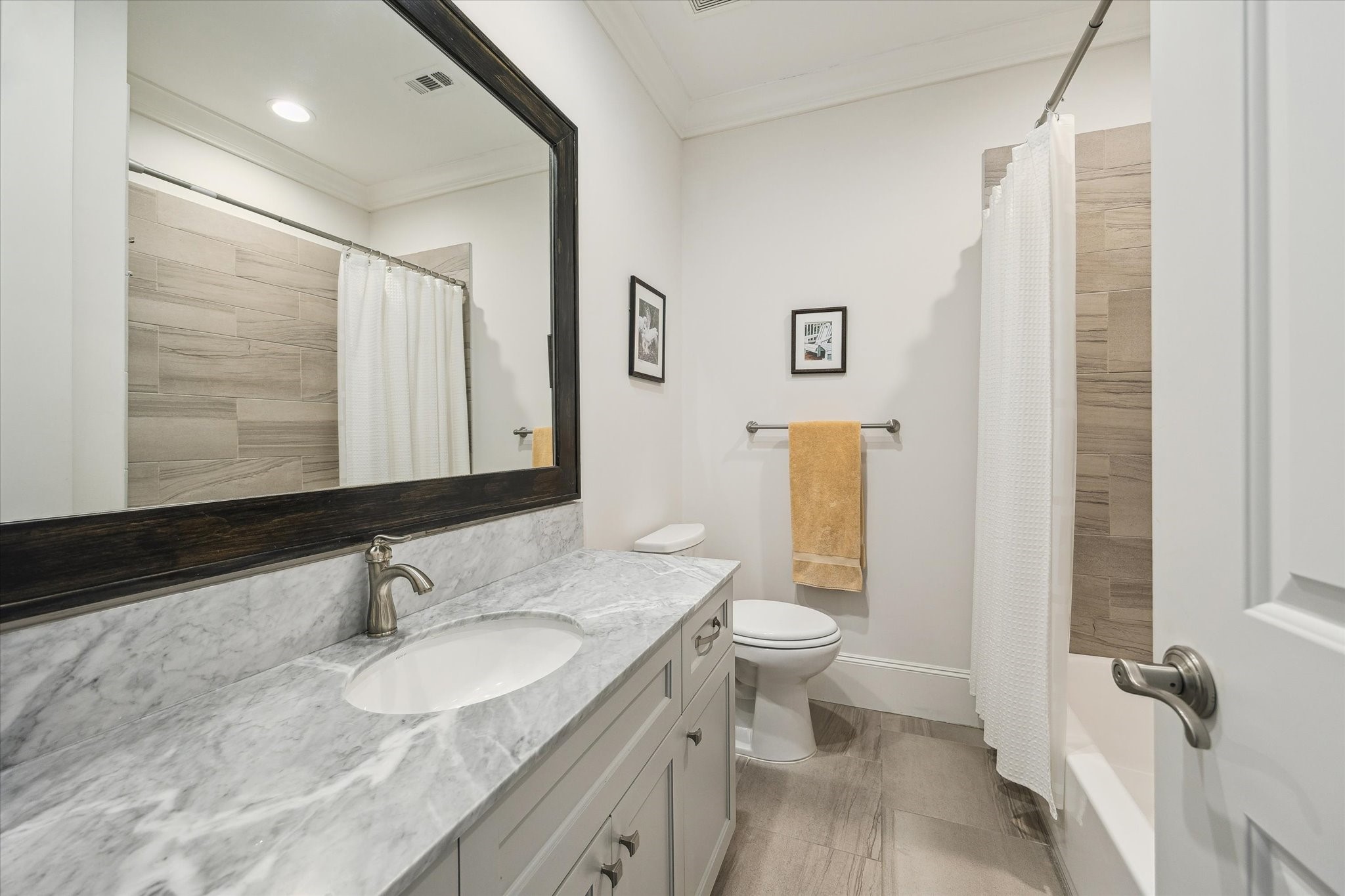 1547 Nevada Street Houston, TX 77006 - Photo 21 of 23 a bathroom with a granite countertop sink toilet and shower