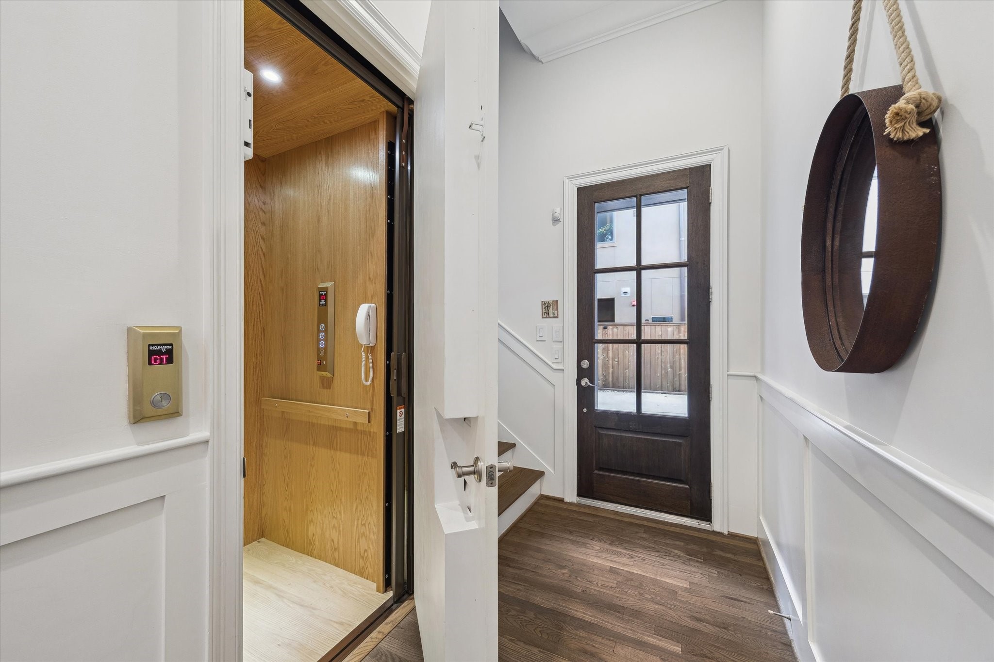 1547 Nevada Street Houston, TX 77006 - Photo 4 of 24 a view of a hallway with wooden floor and windows