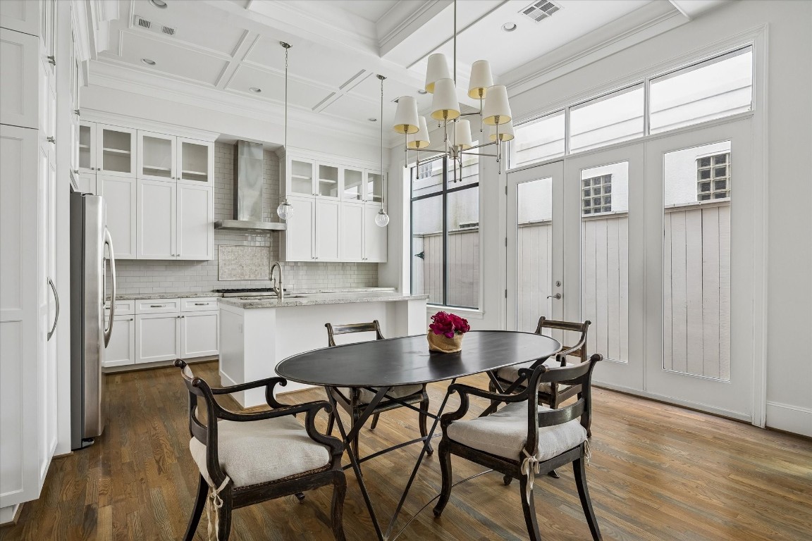 1547 Nevada Street Houston, TX 77006 - Photo 6 of 23 a view of a dining room with furniture and wooden floor