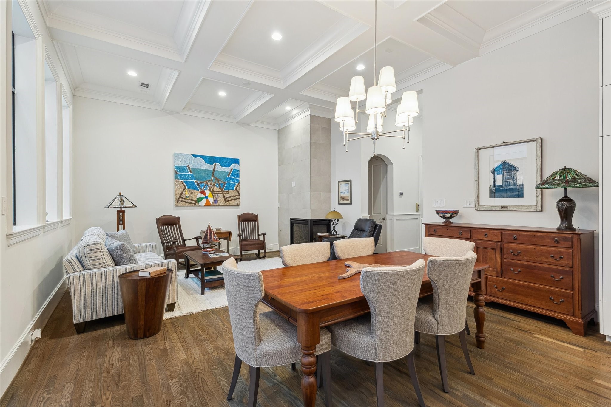 1547 Nevada Street Houston, TX 77006 - Photo 7 of 24 a view of a dining room with furniture a chandelier and wooden floor