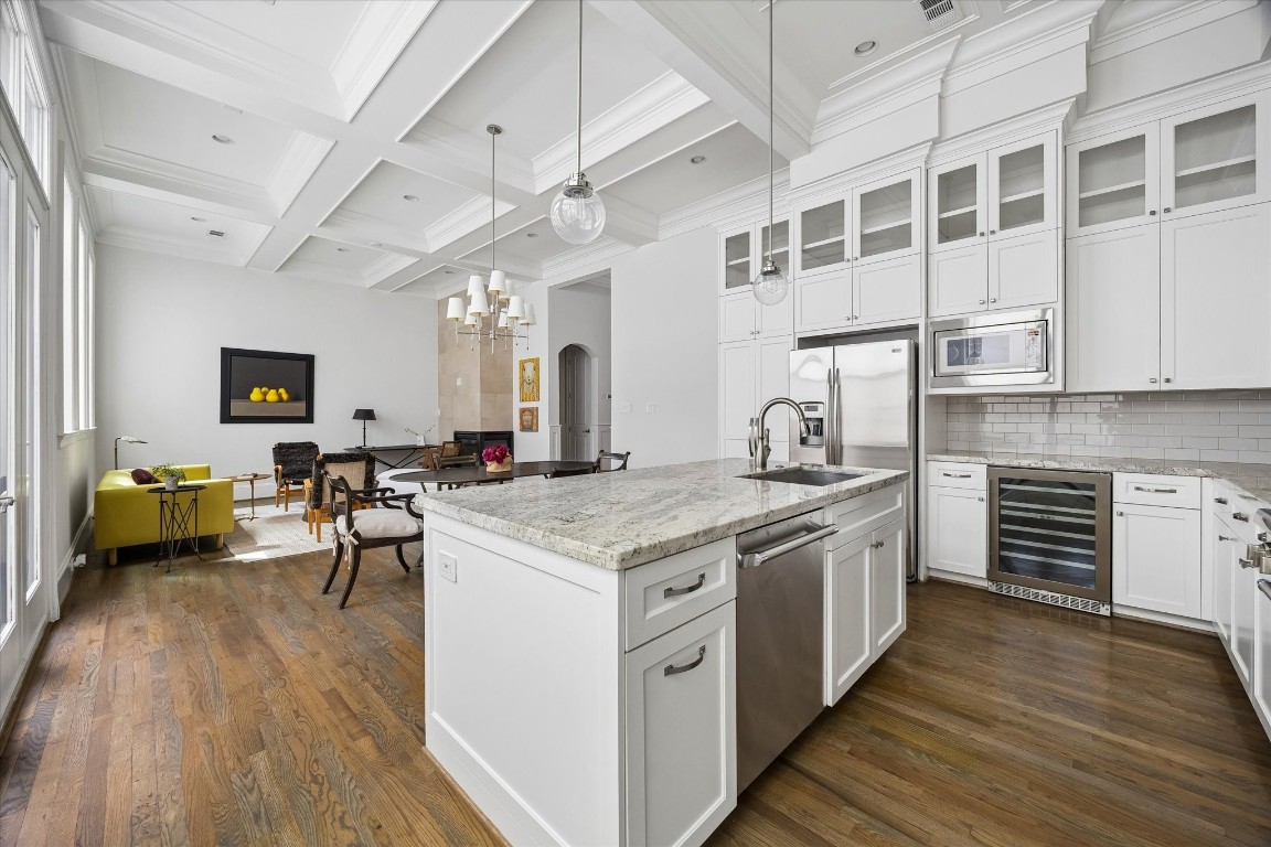 1547 Nevada Street Houston, TX 77006 - Photo 10 of 23 a kitchen with stainless steel appliances granite countertop a stove and a refrigerator
