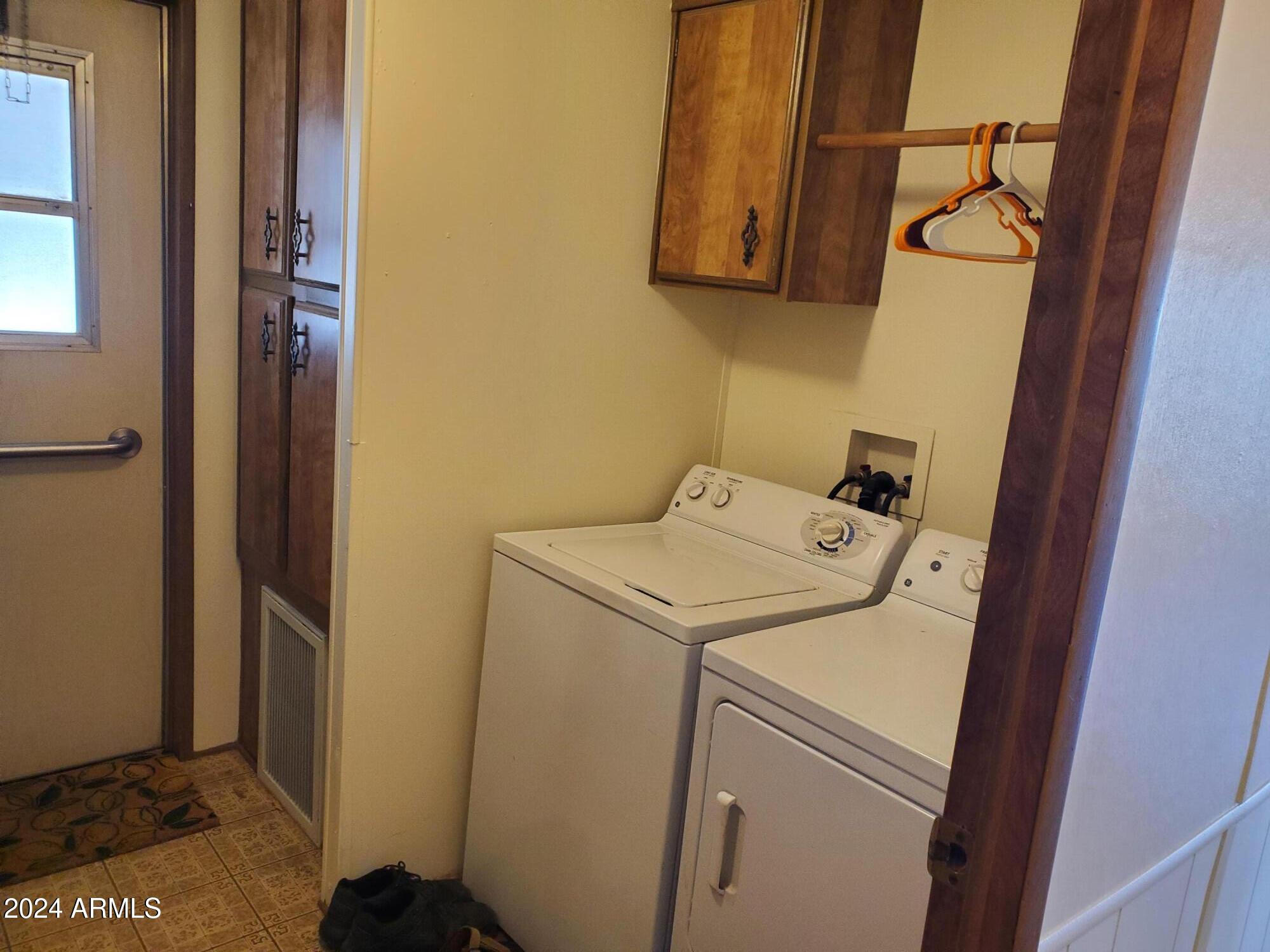 2100 North Trekell Road, Unit 222 Casa Grande, AZ 85122 - Photo 17 of 26 a utility room with dryer and washer