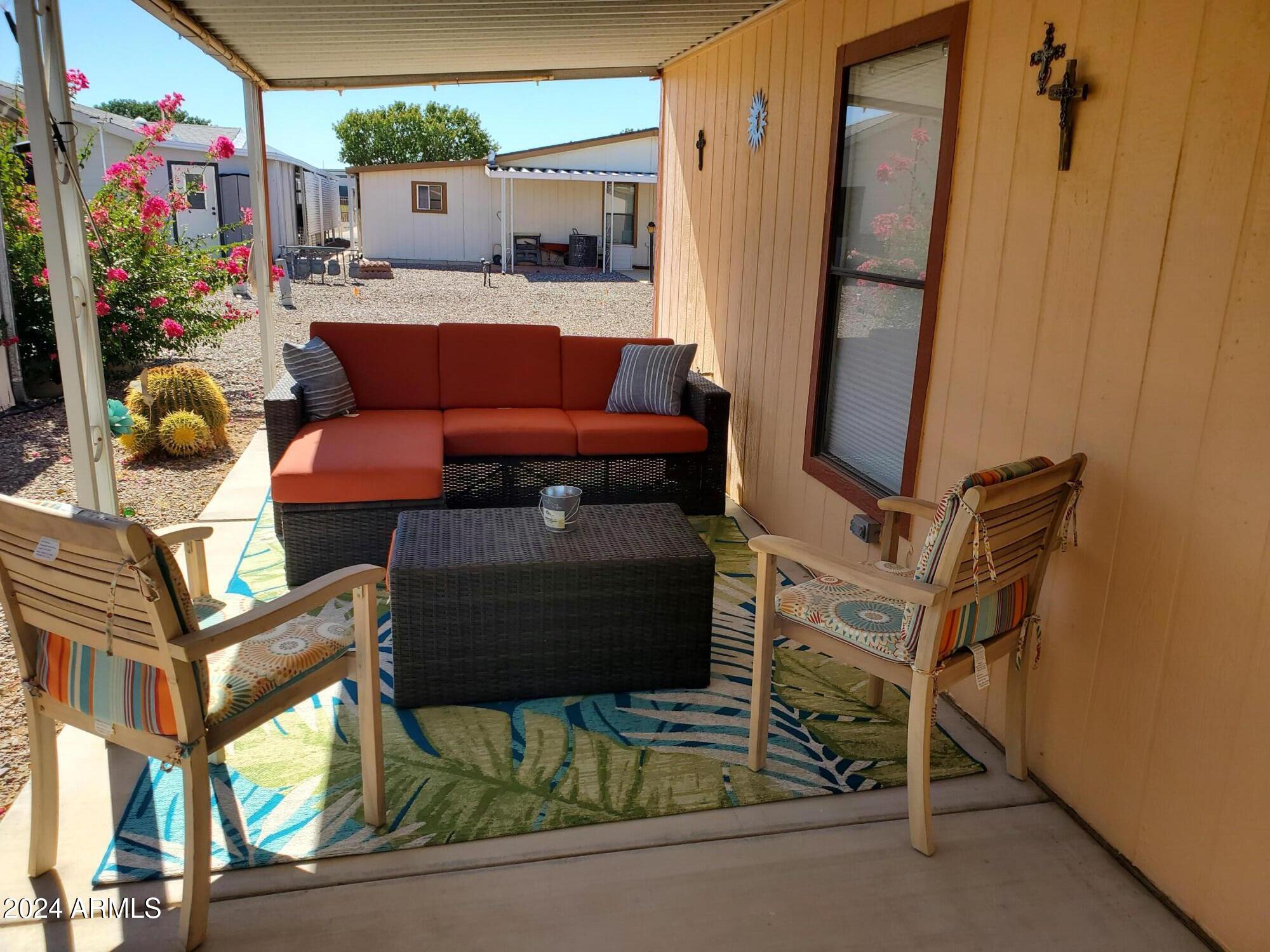 2100 North Trekell Road, Unit 222 Casa Grande, AZ 85122 - Photo 18 of 26 a outdoor living space with patio furniture