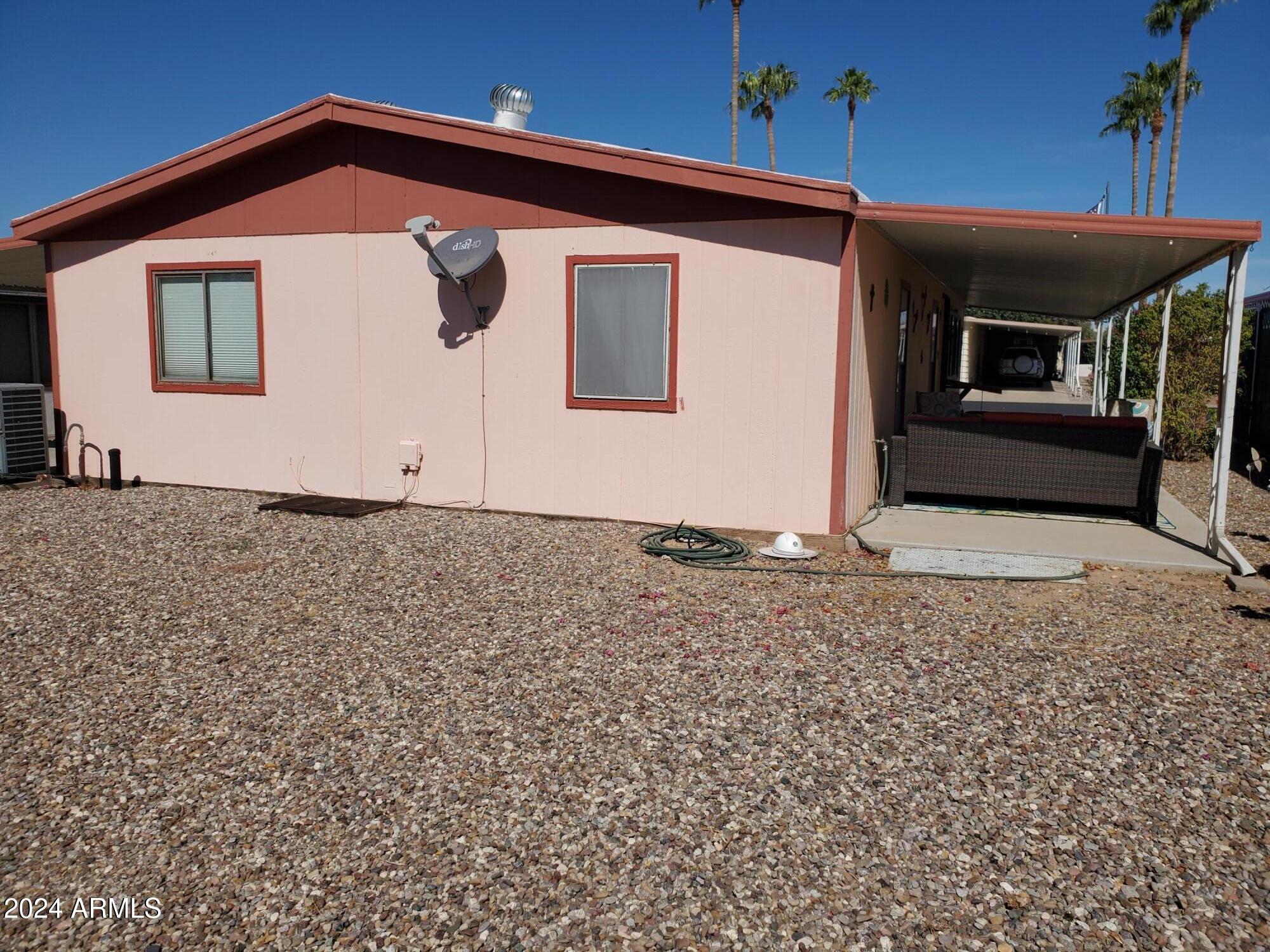 2100 North Trekell Road, Unit 222 Casa Grande, AZ 85122 - Photo 20 of 26 a front view of a house with a yard
