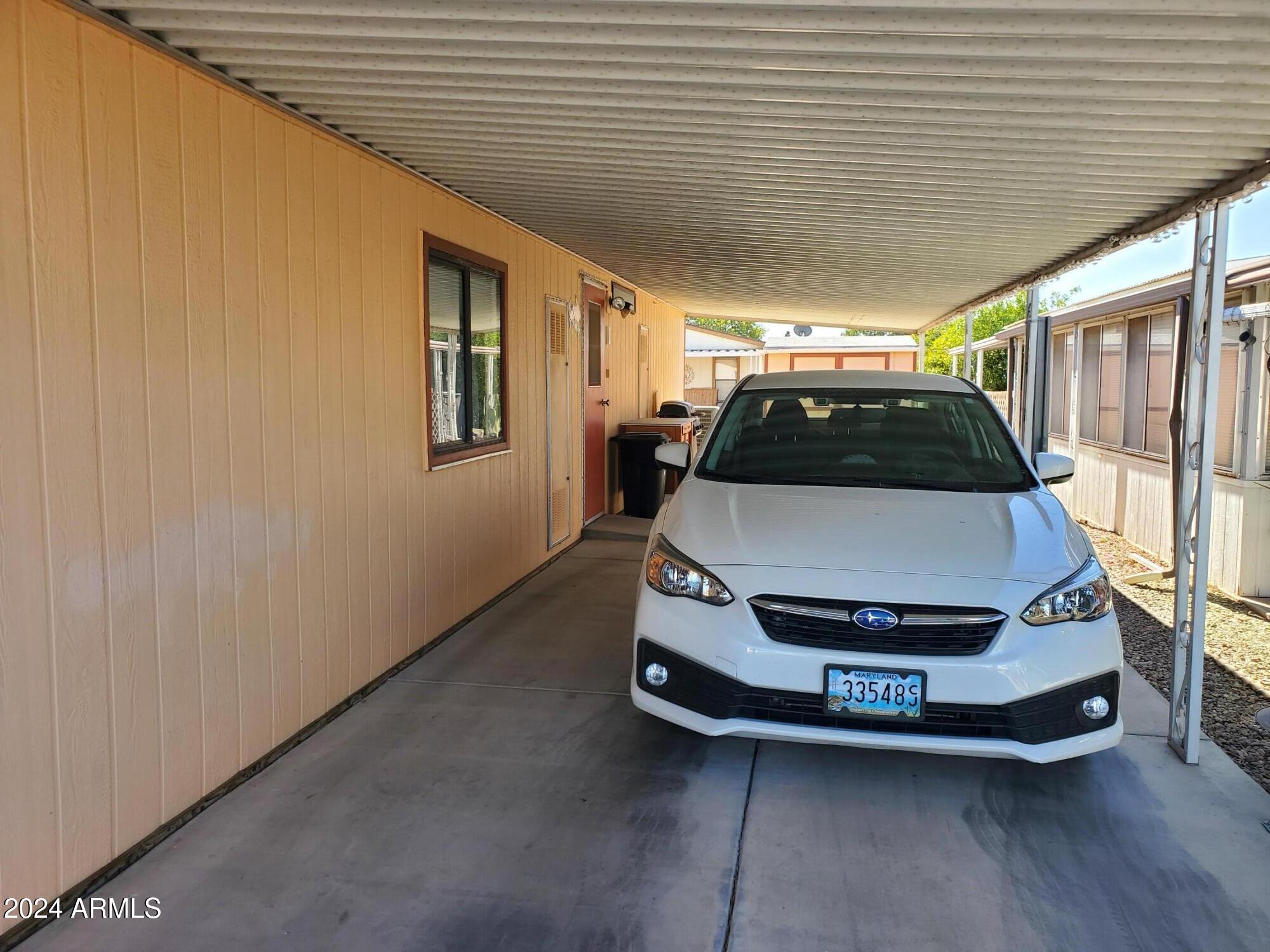 2100 North Trekell Road, Unit 222 Casa Grande, AZ 85122 - Photo 23 of 26 a car parked in front of a house