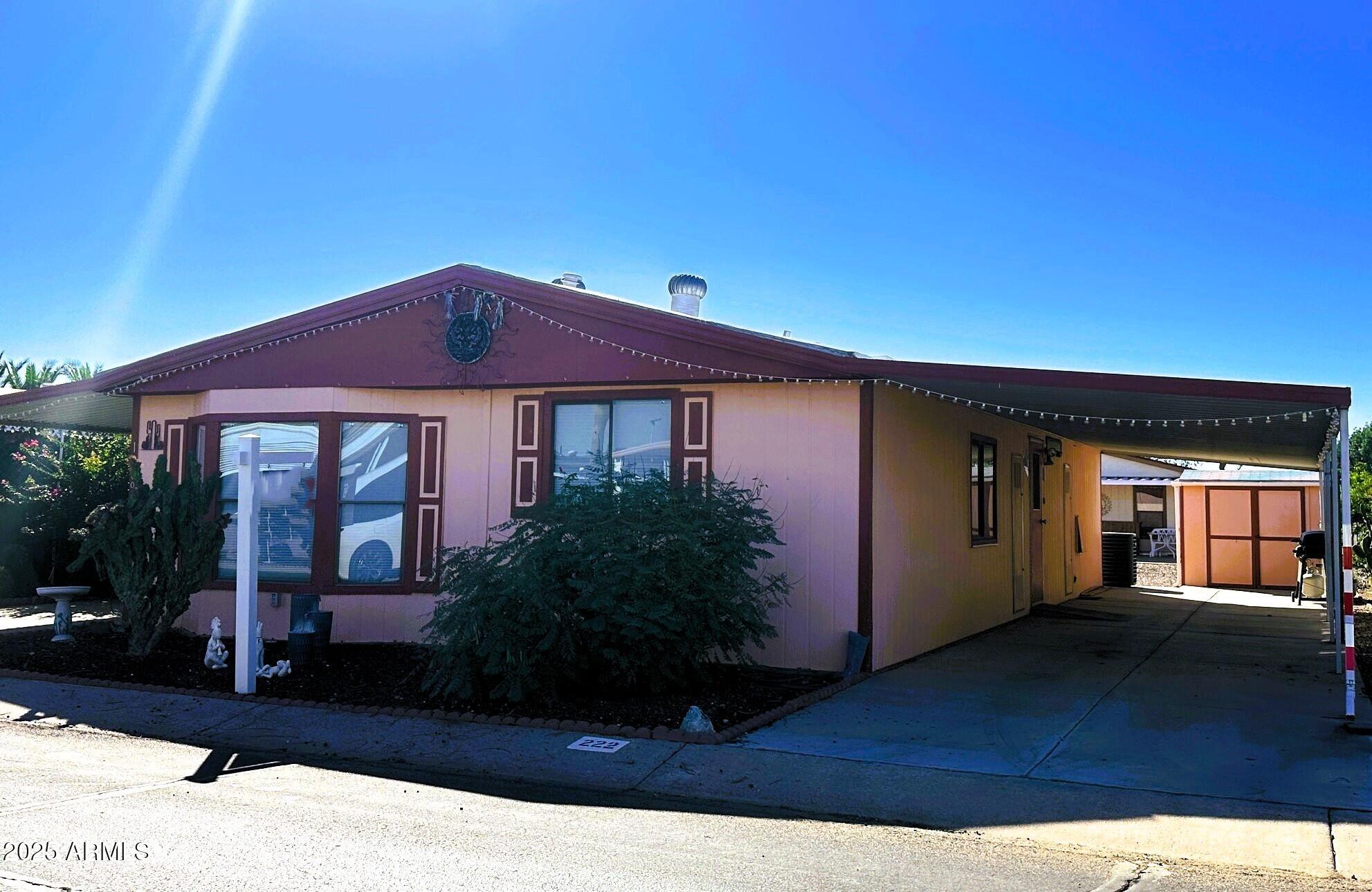 2100 North Trekell Road, Unit 222 Casa Grande, AZ 85122 - Photo 25 of 26 a front view of a house with garden