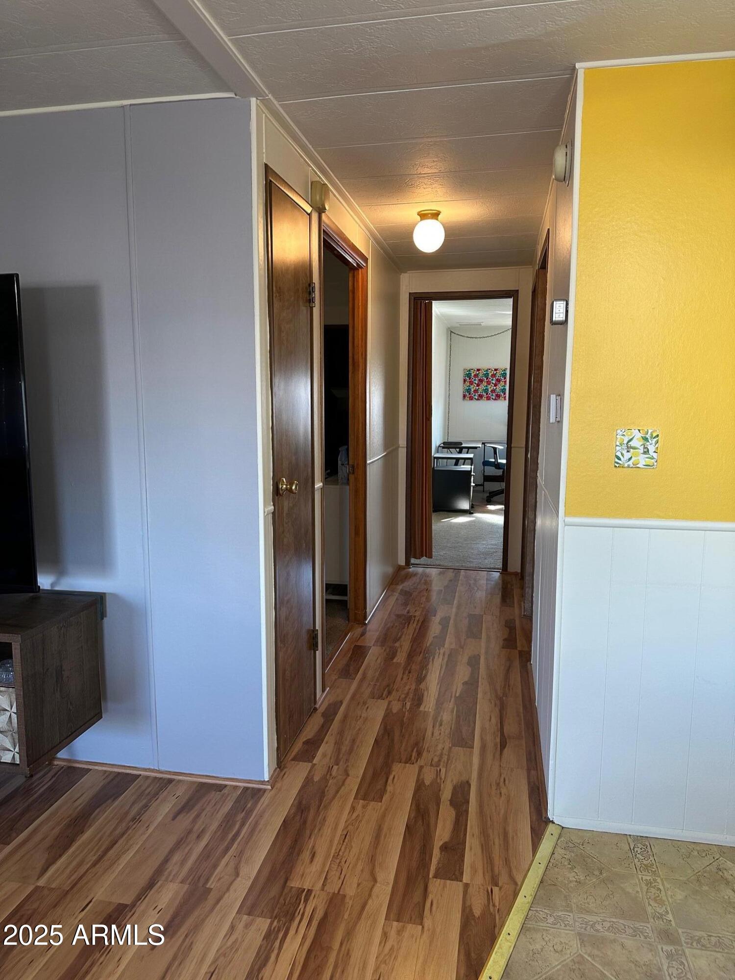 2100 North Trekell Road, Unit 222 Casa Grande, AZ 85122 - Photo 10 of 26 a view of a hallway with wooden floor