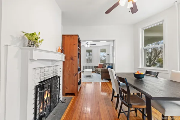 a view of a dining room with furniture window and wooden floor