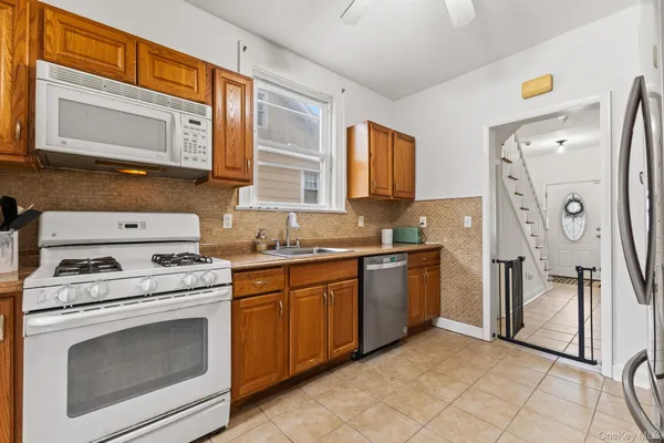 a kitchen with a stove microwave and refrigerator