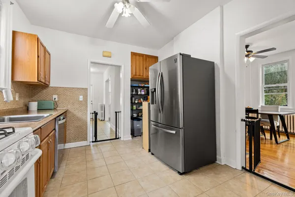 a kitchen with a refrigerator and a sink