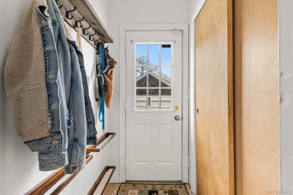 a view of walk in closet with clothes