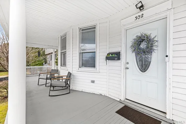 a view of living room filled with furniture and window