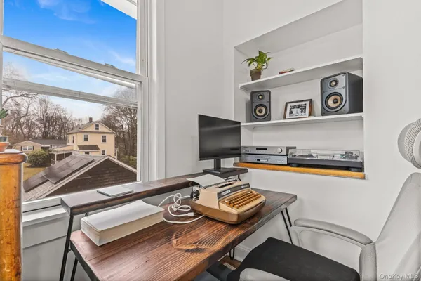 a view of a workspace with furniture