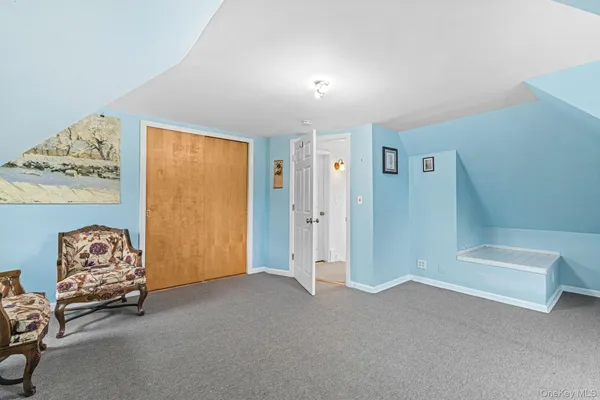 a view of livingroom with furniture and a window