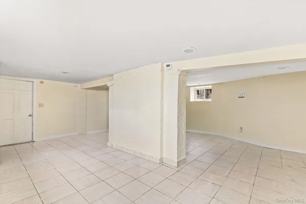 an empty room with white walls