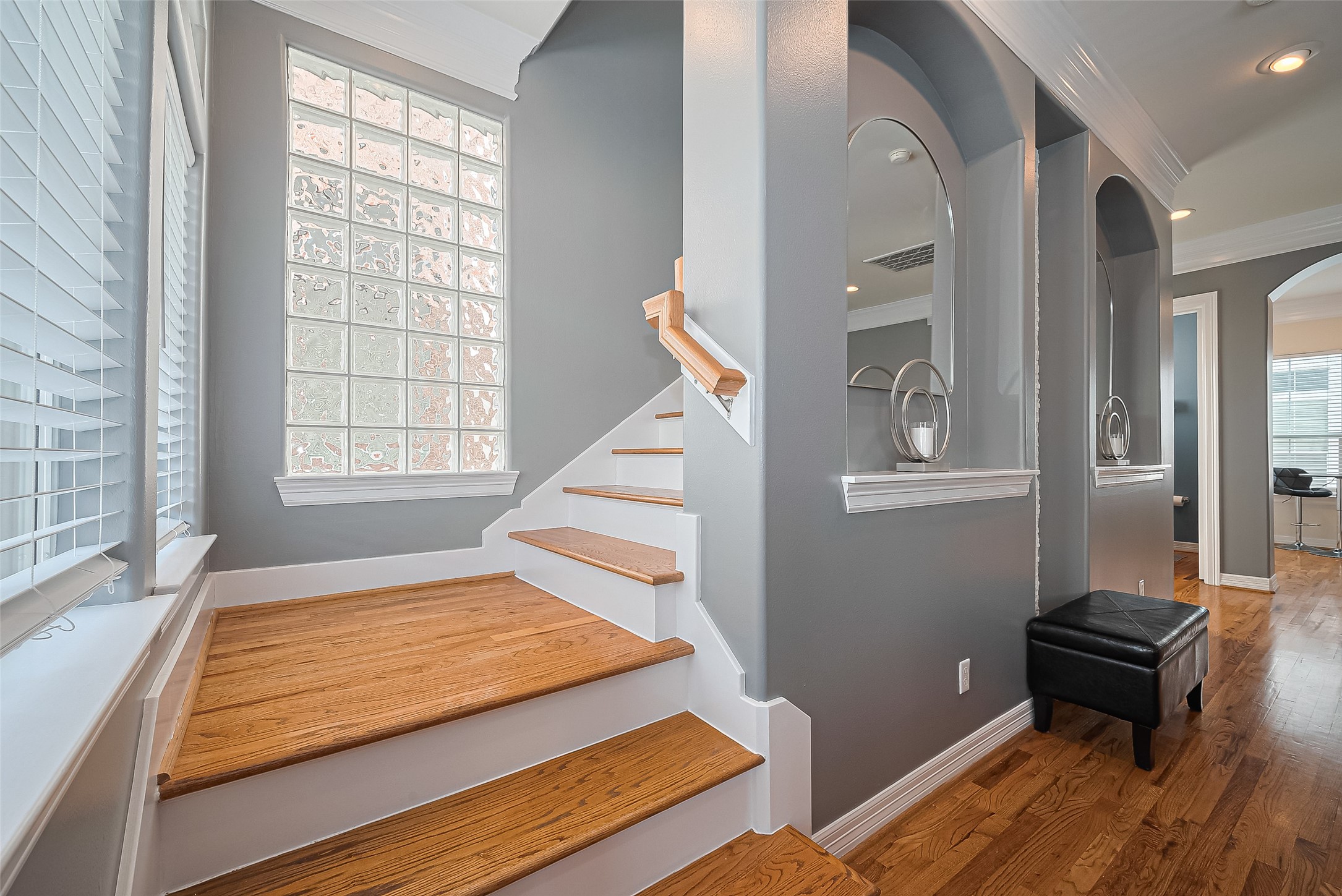 3925 Floyd Street Houston, TX 77007 - Photo 14 of 24 a bedroom with a bed and wooden floor