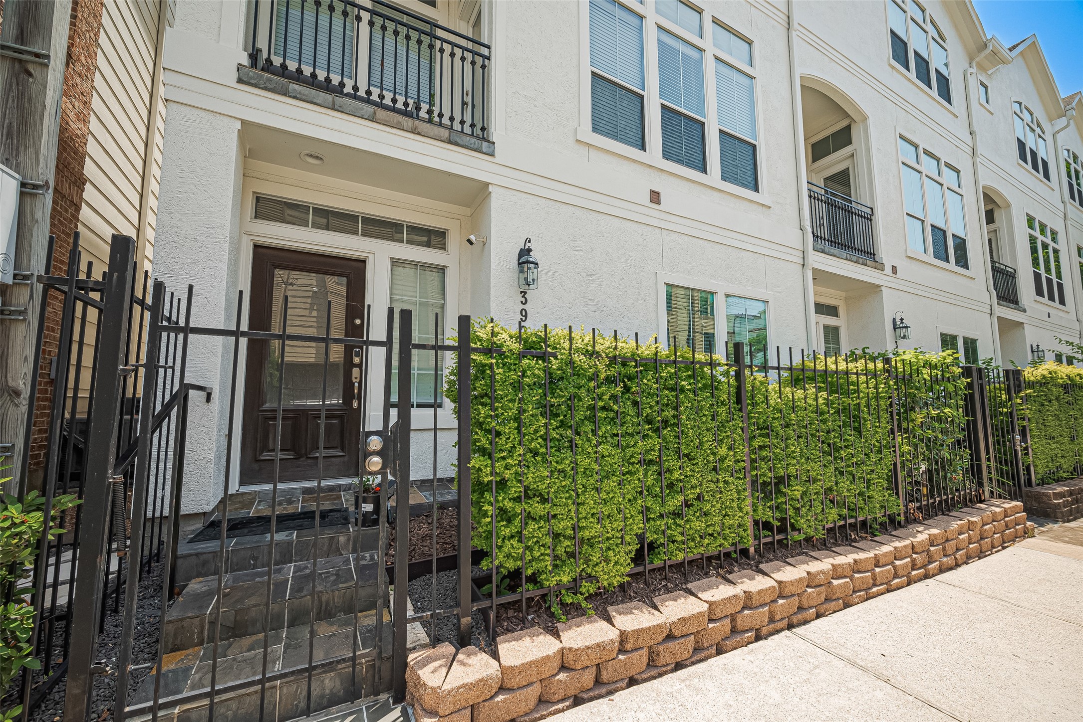 3925 Floyd Street Houston, TX 77007 - Photo 2 of 24 a view of a brick building next to a yard