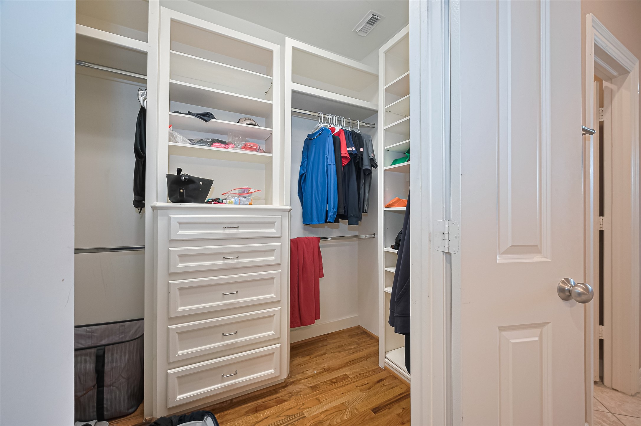 3925 Floyd Street Houston, TX 77007 - Photo 24 of 24 a view of walk in closet with clothes and shoes