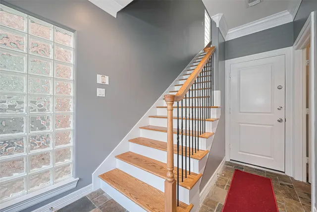 a view of staircase with white walls and windows