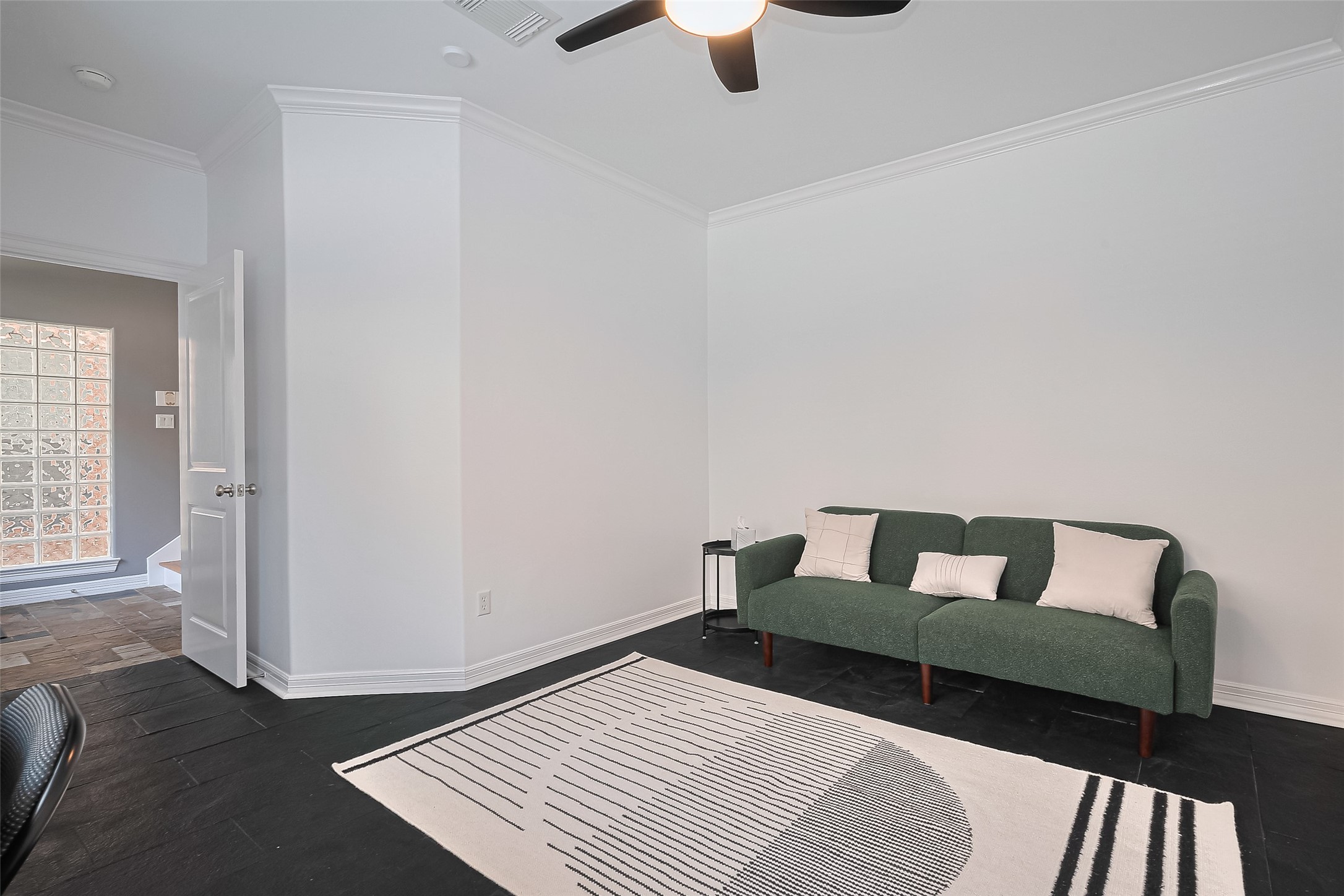 3925 Floyd Street Houston, TX 77007 - Photo 6 of 24 a bedroom with a bed and wooden floor