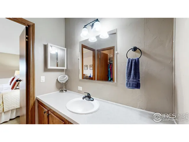 a bathroom with a sink vanity and mirror