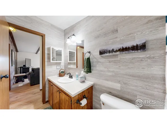 a bathroom with a sink a mirror and a bathtub