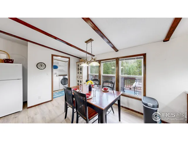 a bedroom with two beds and a window