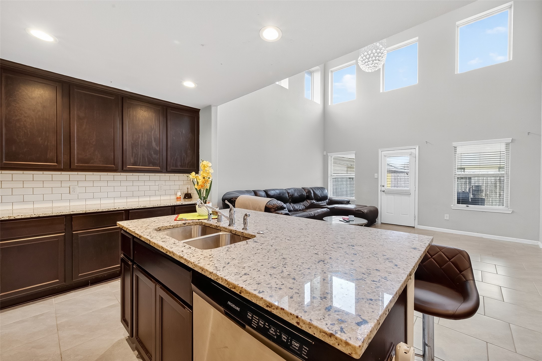 8007 Carillon Way Rosharon, TX 77583 - Photo 11 of 33 a kitchen with granite countertop a sink and cabinets