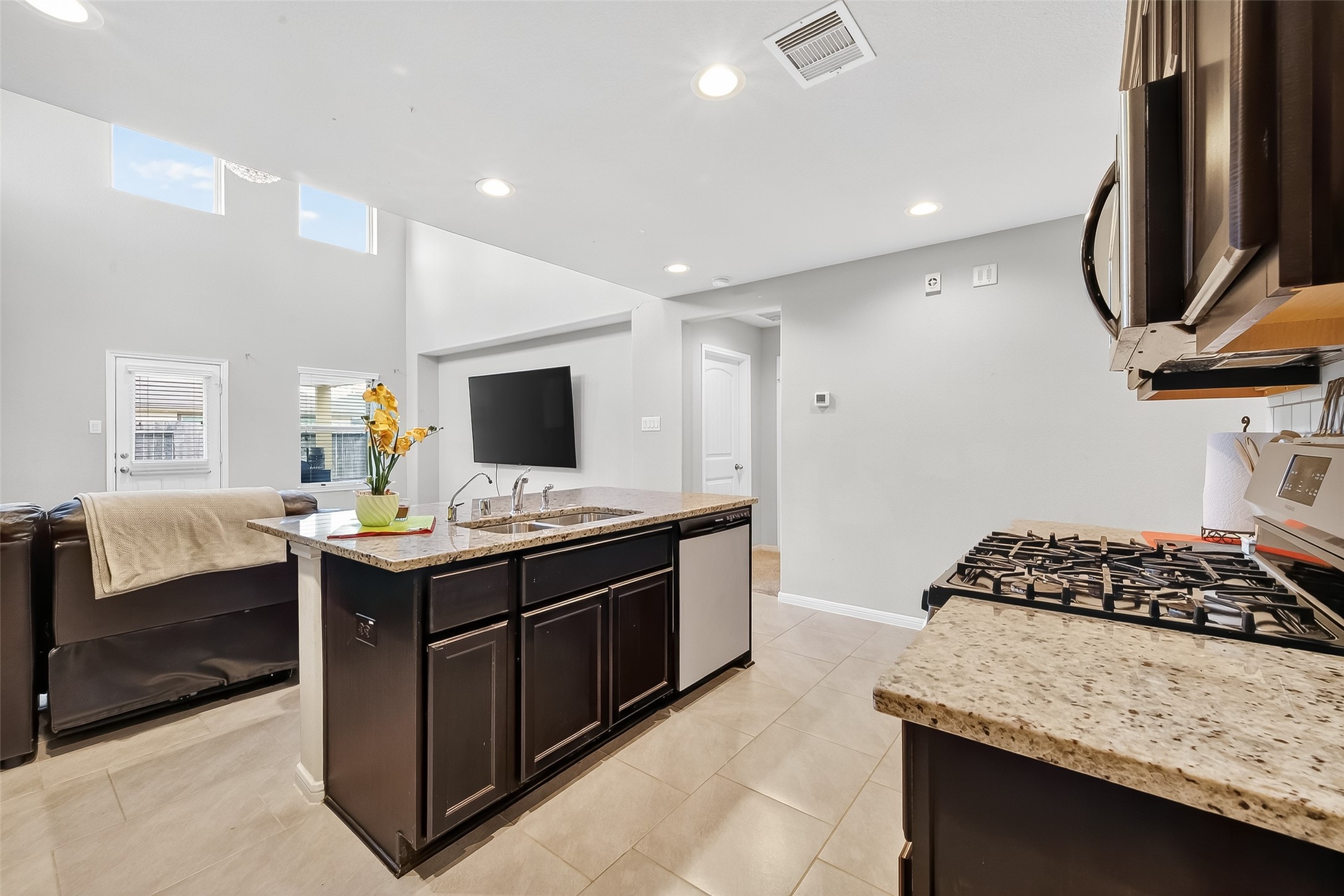 8007 Carillon Way Rosharon, TX 77583 - Photo 15 of 33 a kitchen with stainless steel appliances granite countertop a stove and a sink