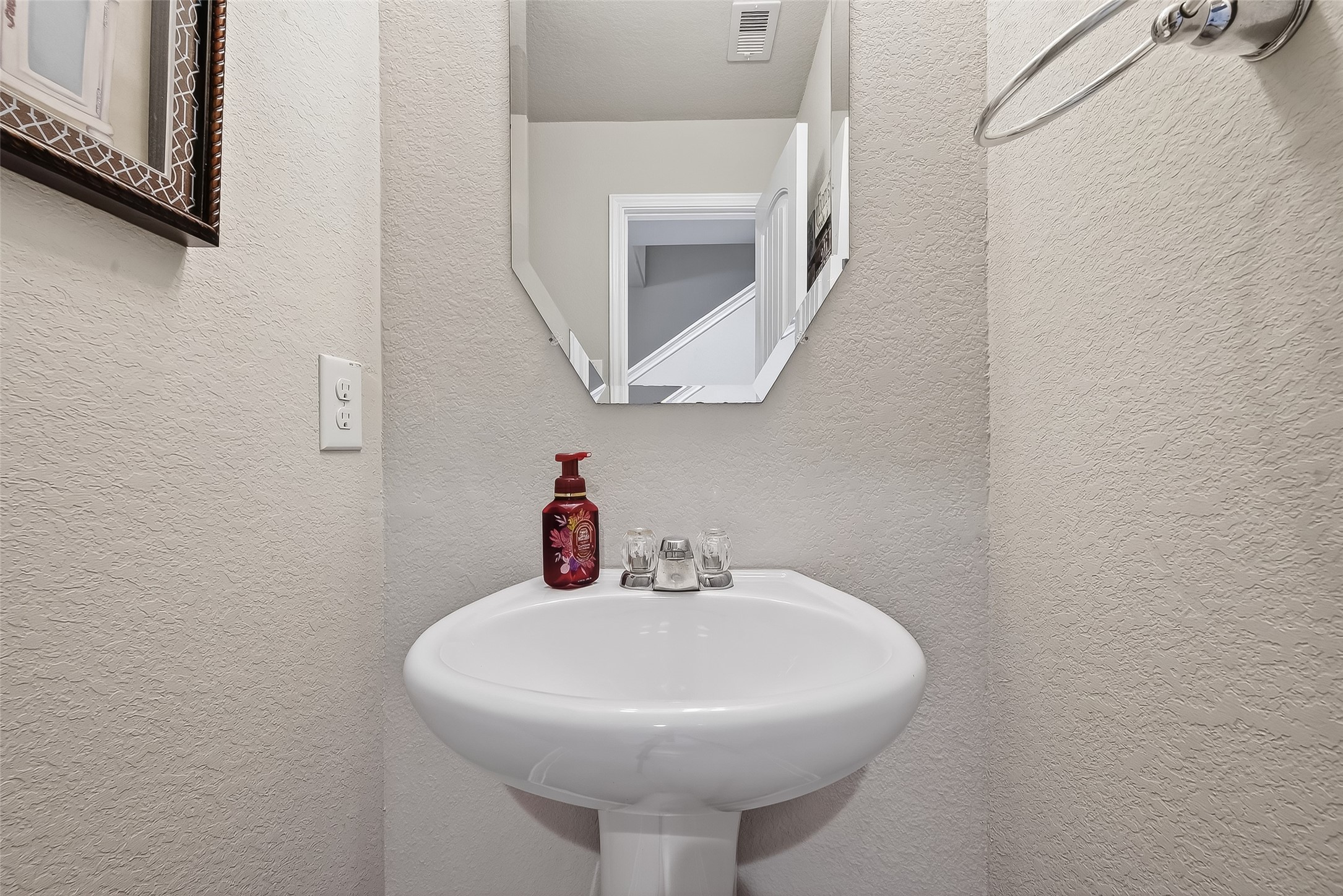 8007 Carillon Way Rosharon, TX 77583 - Photo 18 of 33 a bathroom with a sink and a mirror