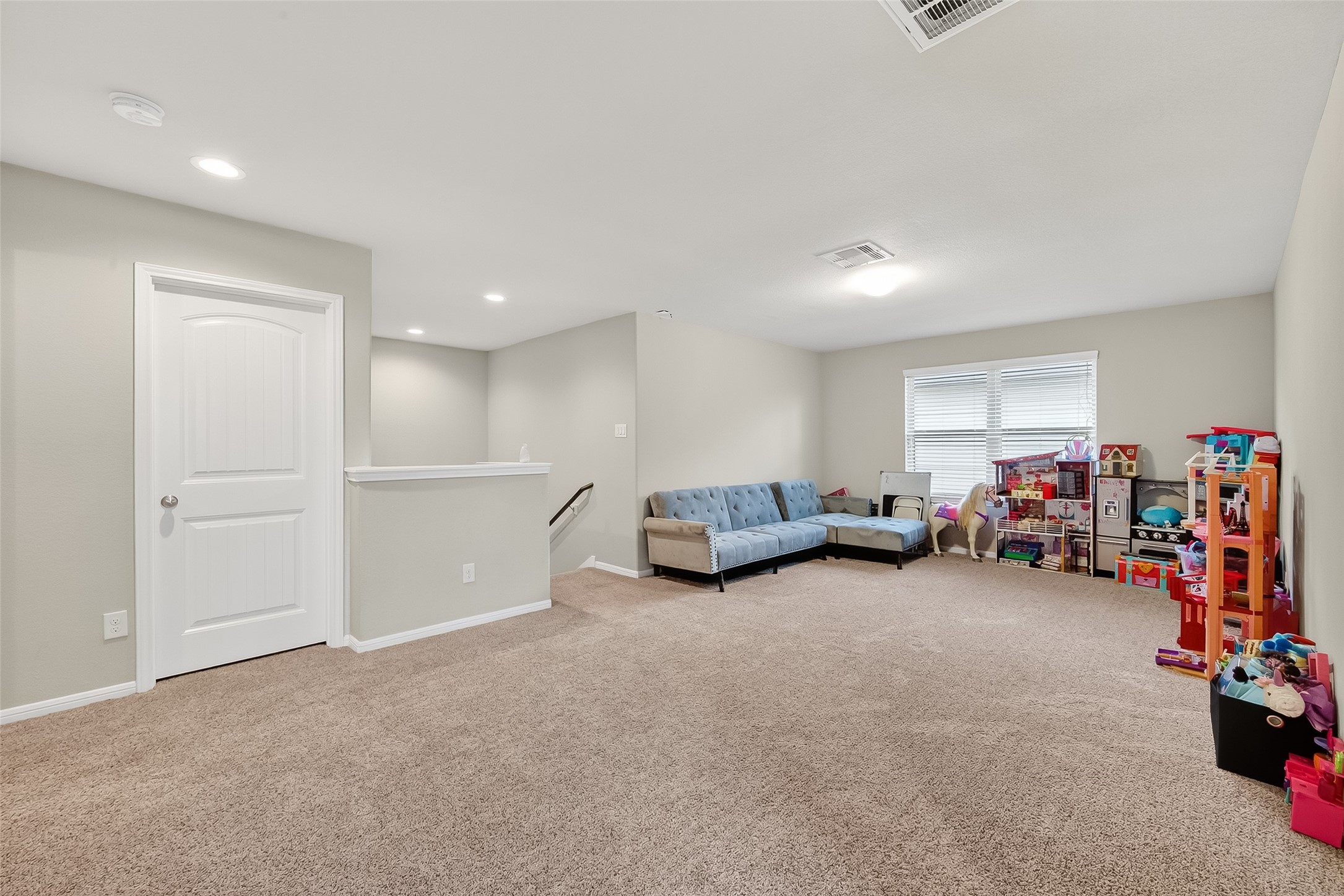 8007 Carillon Way Rosharon, TX 77583 - Photo 24 of 33 a view of a livingroom with furniture and a garage